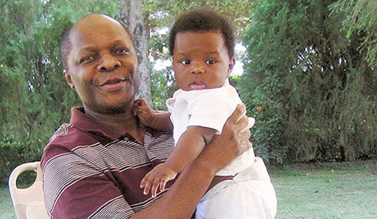Kabaka Mutebi and baby son, Richard Ssemakookiro.