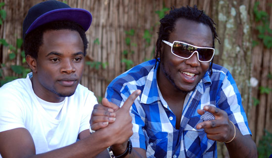 Simon Peter (left) and Sizzaman hanging out. Photo By Edgar R. Batte