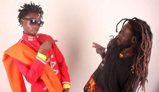 Khalifa gestures with his Rastafarian fan Snake at Twinkle Star Agency. PHOTO BY ISAAC SSEJJOMBWE