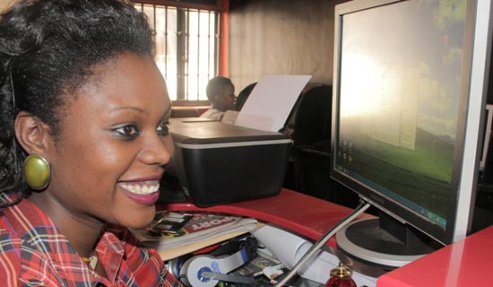 Magezi at work in her Internet café. PHOTO BY ISAAC SSEJJOMBWE