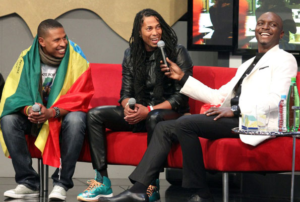 Ethiopia’s Bimp with South Africa’s Angelo and show host IK during their eviction. COURTESY PHOTO