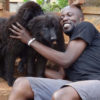 Rwothomio with some of his dogs. PHOTO BY ISAAC SSEJJOMBWE