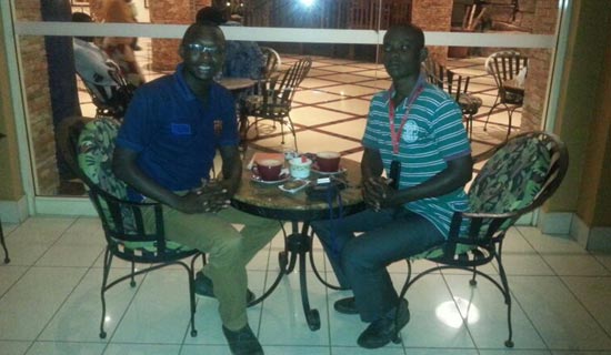 Suhail Mugabi (L) with his fan Allan Bbale at the Kampala Serena Hotel. PHOTO BY I. SSEJJOMBWE