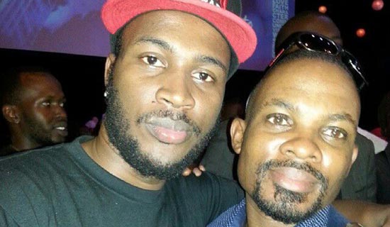 Don MC (L) and his fan Magandaazi, a car dealer. PHOTO BY ISAAC SSEJJOMBWE