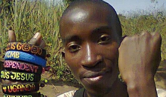 Ayomire shows off some of his works. PHOTO BY ISAAC SSEJJOMBWE