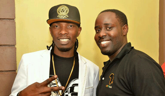 GNL Zamba (L) poses with Eugene Kawooya . PHOTO BY ISAAC SSEJJOMBWE