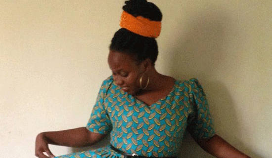 Ikwang shows off some of her designs. PHOTO BY ISAAC SSEJJOMBWE