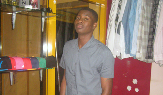 Onjima in his boutique, Fashion Bay, at Equatorial Shopping Mall. PHOTO BY ISAAC SSEJJOMBWE