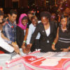 Students and university officials cut the third anniversary cake. PHOTOS BY ISMAIL KEZAALA