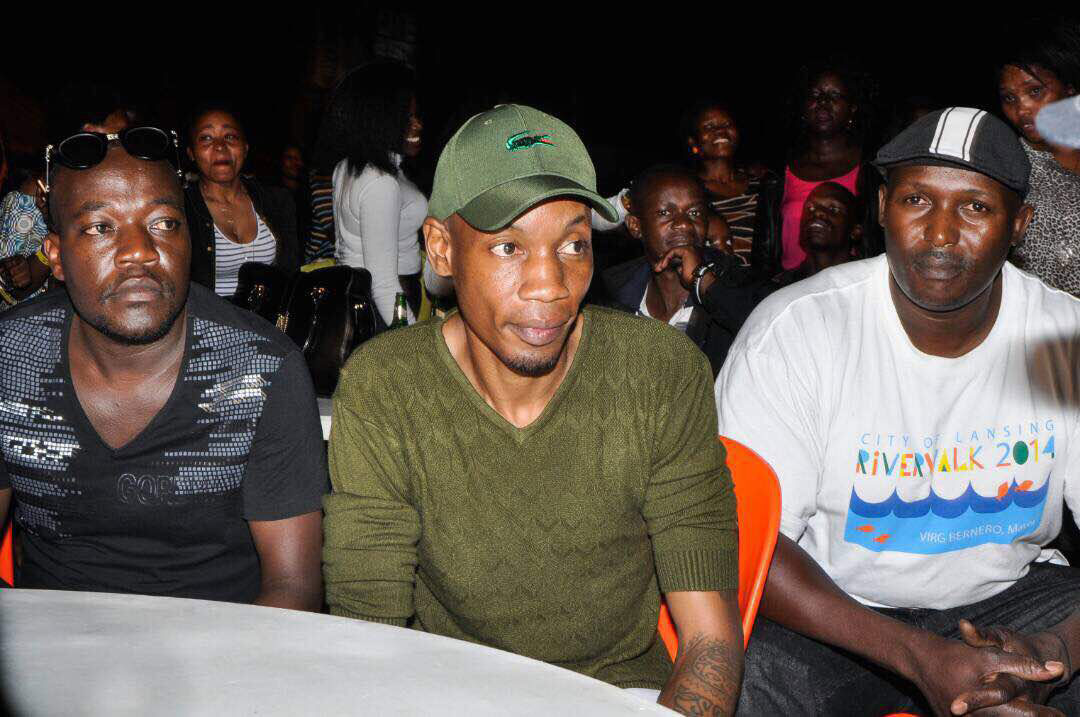 Young tycoon Bryan White (C) and his personal security at the Radio & Weazal 10 years anniversary concert