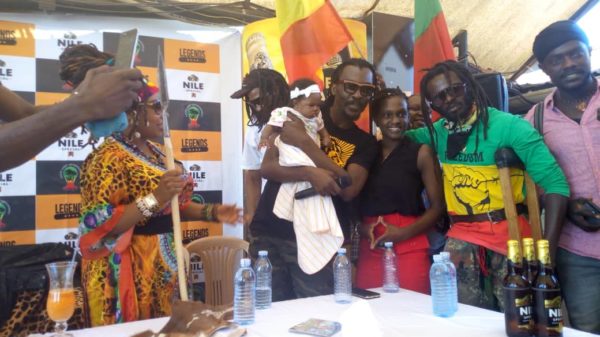 Buchaman with the wife asked Anthony B to bless their newly born