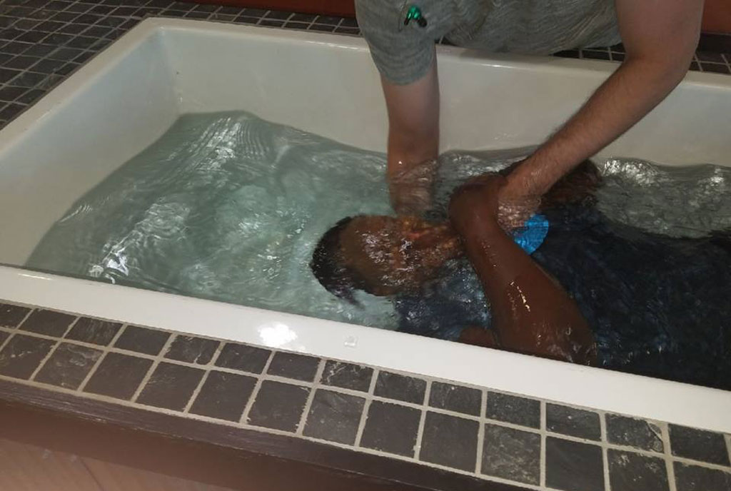Remmy Bahati getting baptised at new christian life church, in Virginia, US.