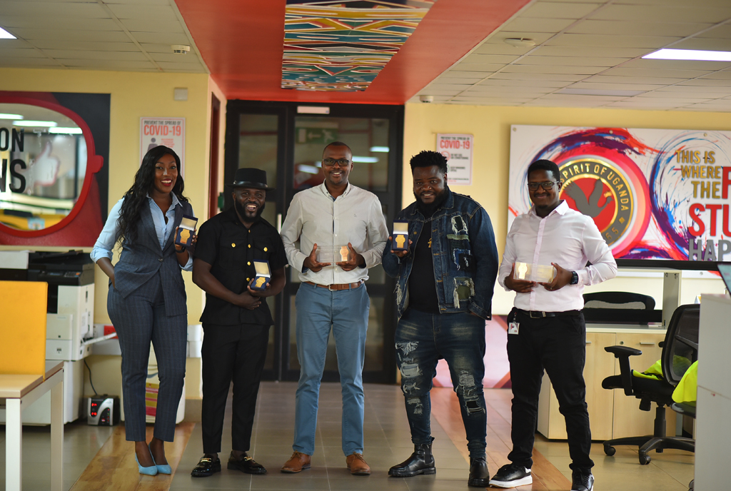 UG Brand Ambassadors Tinah Teise, Madrat & Chico pose for a picture with Emmy Hashakimana - UBL Marketing Director (center) & Hillary Baguma - UG Brand Manager (R)